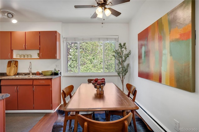 1201 Race St Unit 10, Denver, CO 80206 - dining area with dark wood finished floors, ceiling fan, and a baseboard heating unit