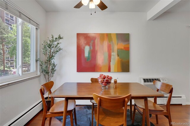 1201 Race St Unit 10, Denver, CO 80206 - dining room with a baseboard radiator, wood finished floors, and a ceiling fan