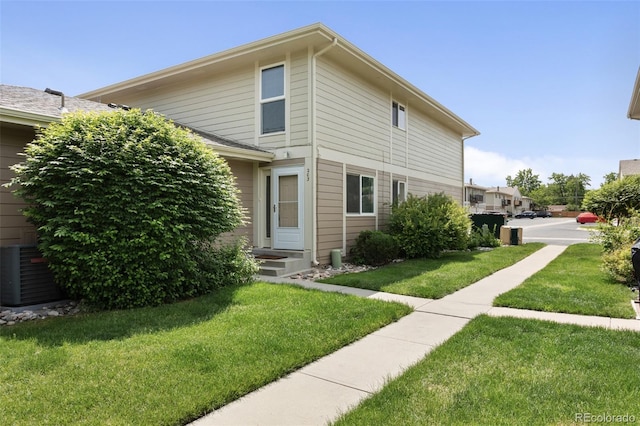 6650 E Arizona Ave Unit 203, Denver, CO 80224 - view of side of home with a lawn and cooling unit