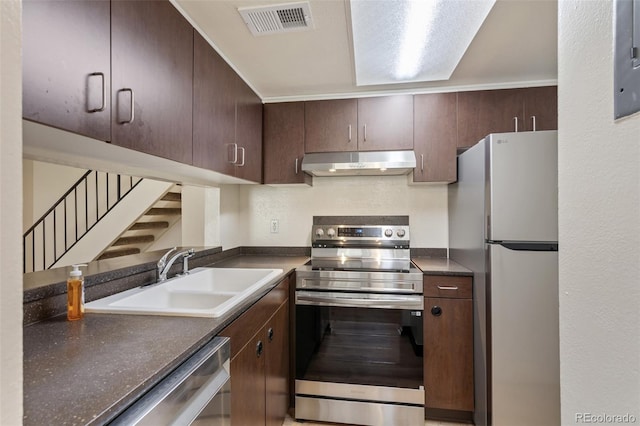 6650 E Arizona Ave Unit 203, Denver, CO 80224 - kitchen featuring stainless steel appliances, extractor fan, a sink, dark countertops, and dark brown cabinets