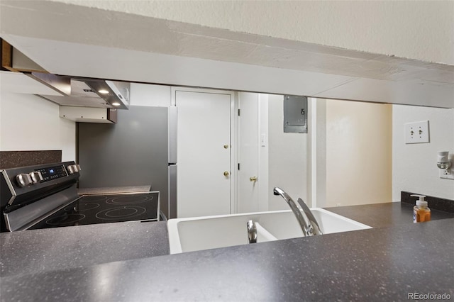 6650 E Arizona Ave Unit 203, Denver, CO 80224 - kitchen featuring electric range, electric panel, a sink, and dark countertops