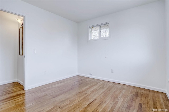 spare room featuring light wood-type flooring