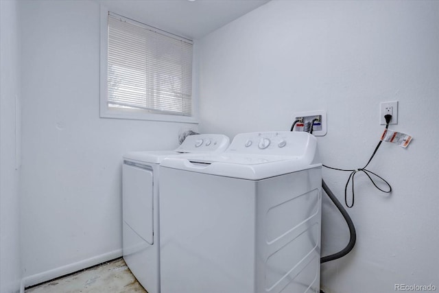 laundry room with washing machine and dryer