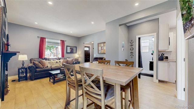 dining room with light wood-type flooring