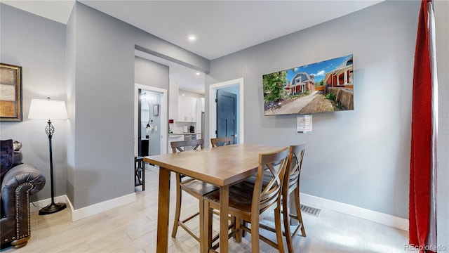 dining area featuring light hardwood / wood-style flooring