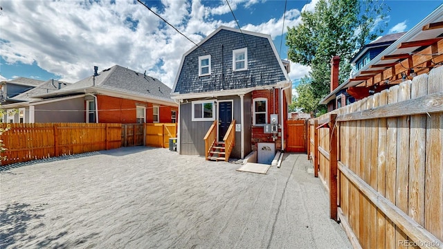 back of house with a patio area