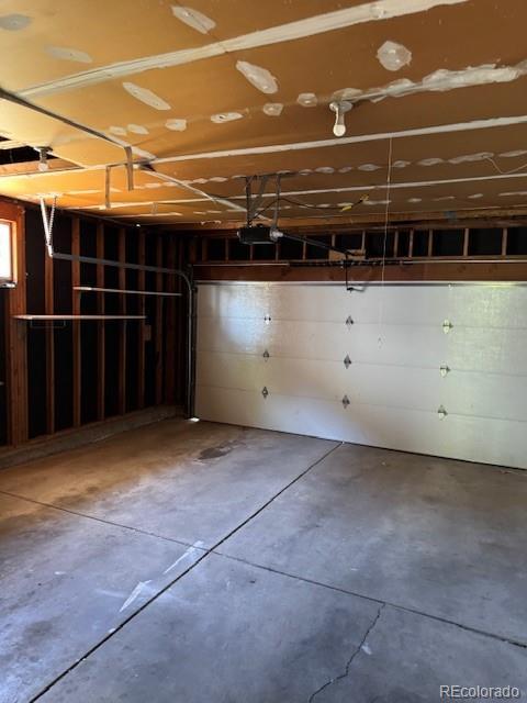 16180 E Flora Pl, Aurora, CO 80013 - garage featuring a garage door opener