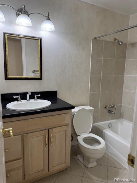 16180 E Flora Pl, Aurora, CO 80013 - full bathroom with toilet, vanity, shower / bath combination, and tile patterned floors