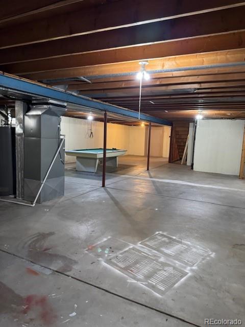 16180 E Flora Pl, Aurora, CO 80013 - unfinished below grade area with water heater, pool table, and heating unit