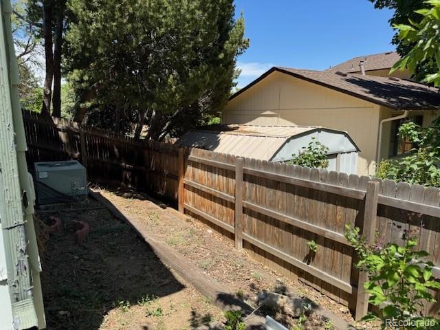 16180 E Flora Pl, Aurora, CO 80013 - fenced backyard with central AC