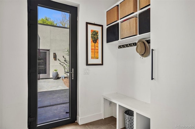mudroom featuring baseboards and tile patterned flooring