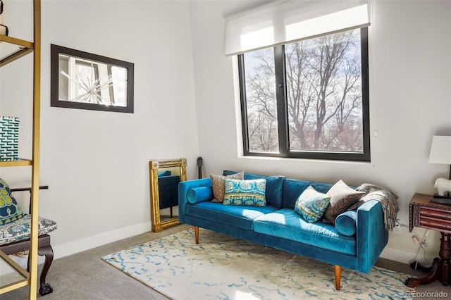 interior space with carpet and baseboards