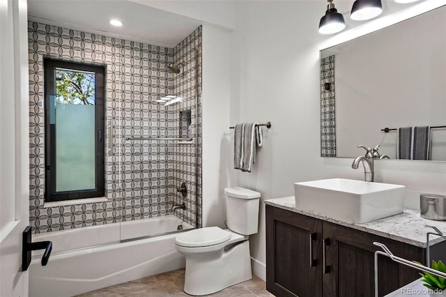 bathroom with vanity, tile patterned floors, shower / bath combination, recessed lighting, and toilet