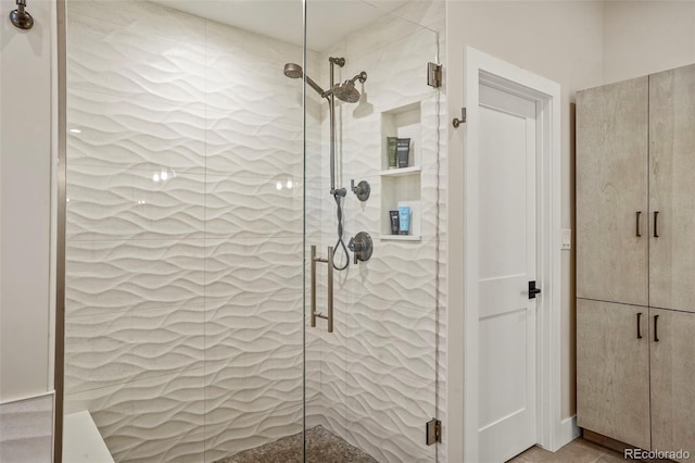 bathroom featuring a shower stall