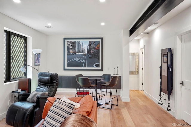 office area with visible vents, baseboards, recessed lighting, and wood finished floors