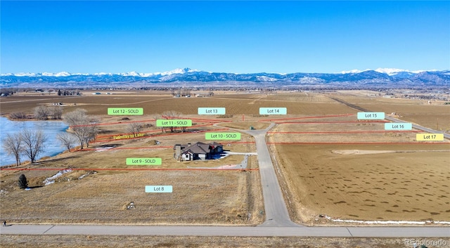 drone / aerial view with a mountain view and a rural view