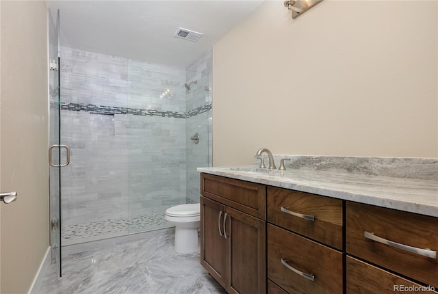 bathroom with walk in shower, vanity, and toilet