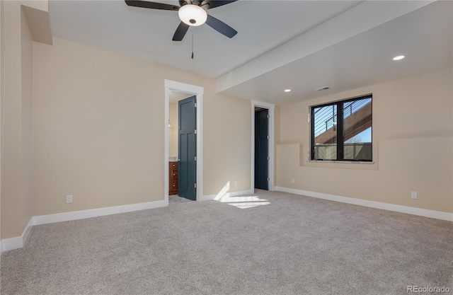 carpeted empty room featuring ceiling fan