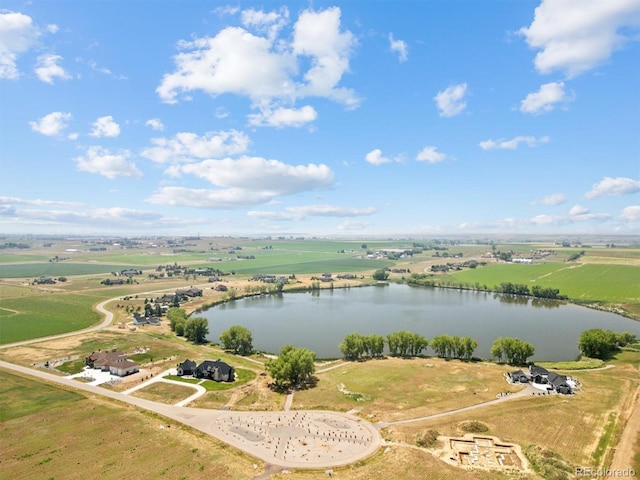 birds eye view of property with a rural view and a water view