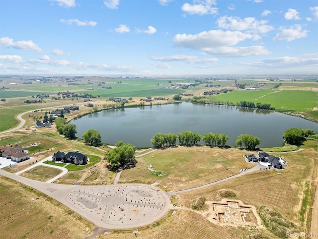 drone / aerial view with a water view and a rural view