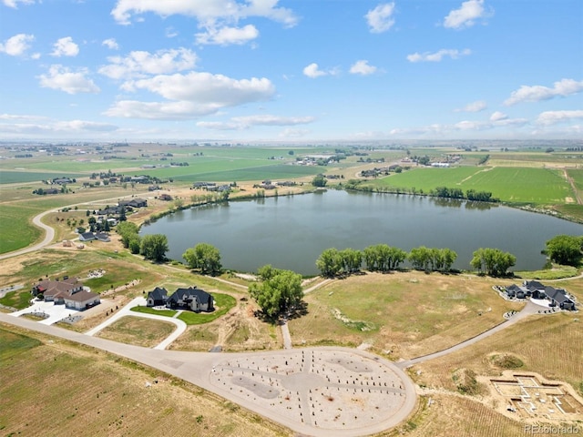 drone / aerial view featuring a rural view and a water view