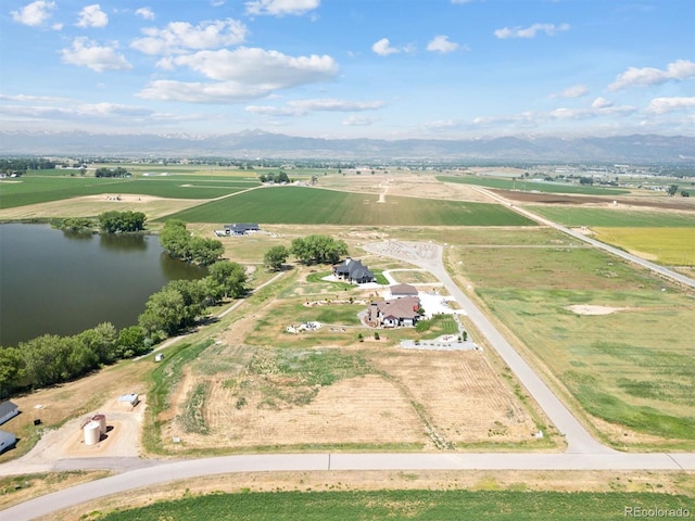 bird's eye view featuring a water and mountain view and a rural view