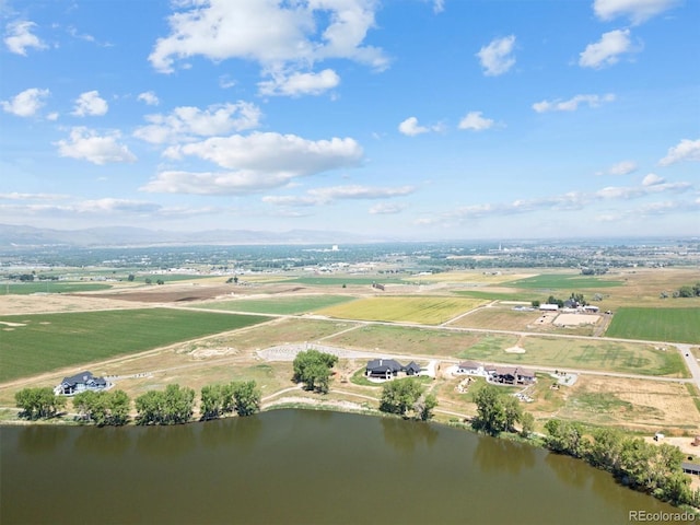 aerial view featuring a rural view and a water and mountain view