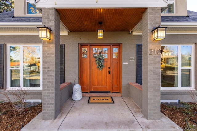 doorway to property with covered porch