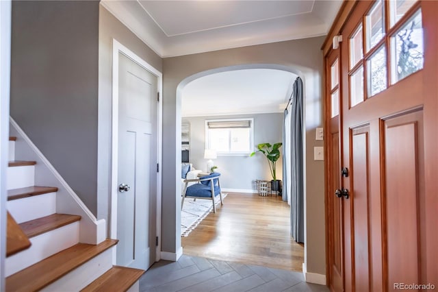 foyer featuring light hardwood / wood-style flooring and ornamental molding