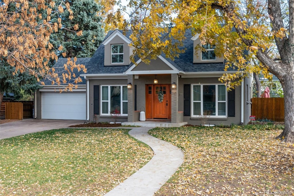 view of front of house featuring a garage and a front yard