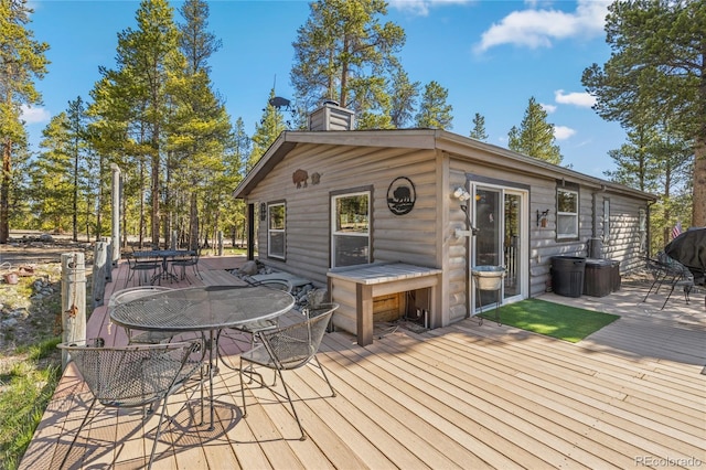 246 Spruce Dr, Twin Lakes, CO 81251 - wooden deck with outdoor dining space and a grill