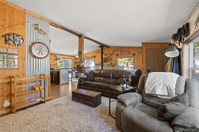 246 Spruce Dr, Twin Lakes, CO 81251 - living area featuring wooden walls, wood finished floors, lofted ceiling, and healthy amount of natural light
