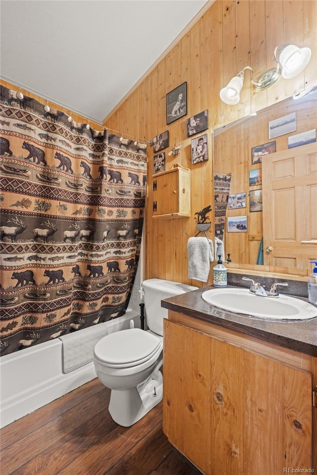 246 Spruce Dr, Twin Lakes, CO 81251 - full bathroom with wood walls, vanity, shower / bath combination with curtain, lofted ceiling, and toilet