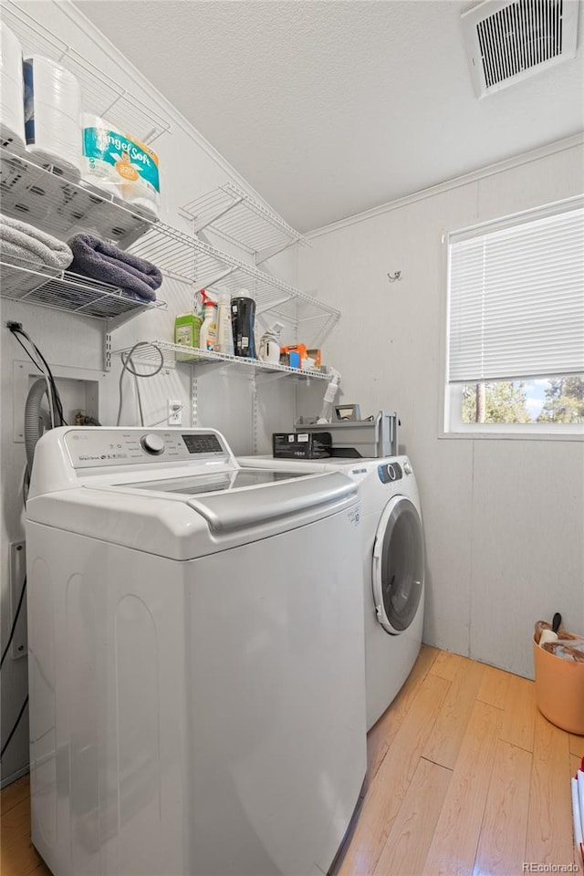 246 Spruce Dr, Twin Lakes, CO 81251 - laundry area with independent washer and dryer and light wood-type flooring