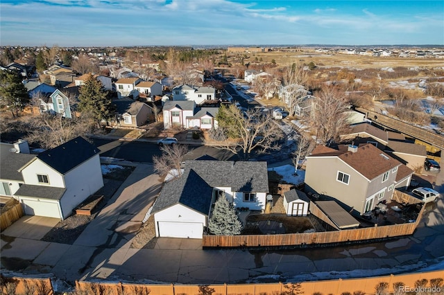 birds eye view of property with a residential view