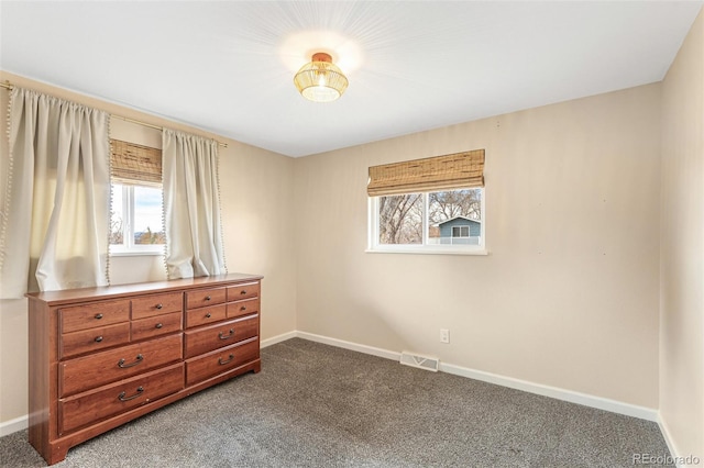 6614 Everett St, Arvada, CO 80004 - bedroom featuring dark colored carpet and multiple windows