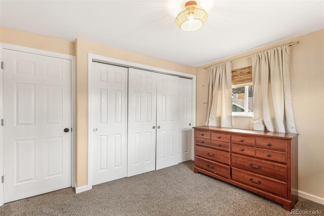 6614 Everett St, Arvada, CO 80004 - carpeted bedroom with a closet and baseboards