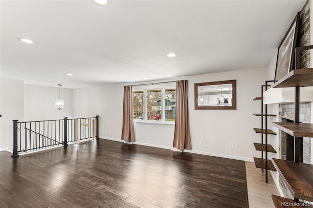 6614 Everett St, Arvada, CO 80004 - empty room featuring wood finished floors, recessed lighting, and a chandelier