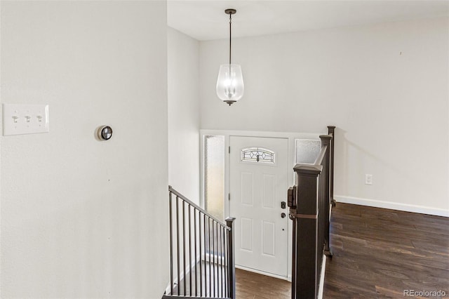 6614 Everett St, Arvada, CO 80004 - entrance foyer featuring dark wood-style flooring and baseboards