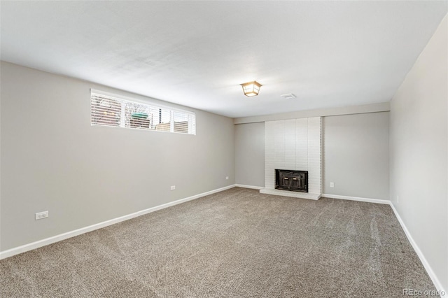 6614 Everett St, Arvada, CO 80004 - unfurnished living room featuring carpet floors and a fireplace