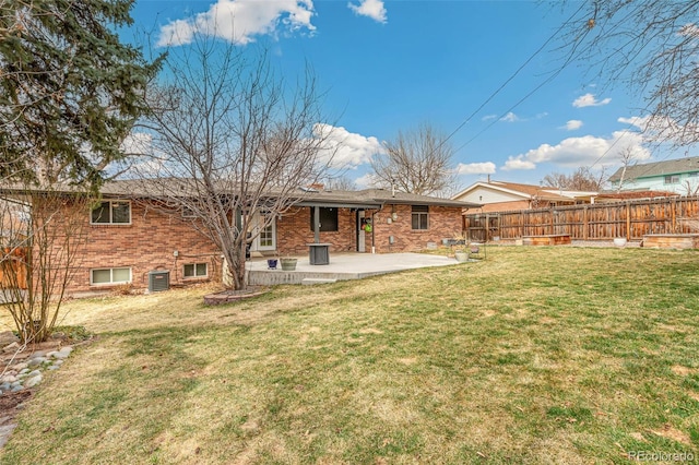 6614 Everett St, Arvada, CO 80004 - rear view of property featuring a patio area and brick siding