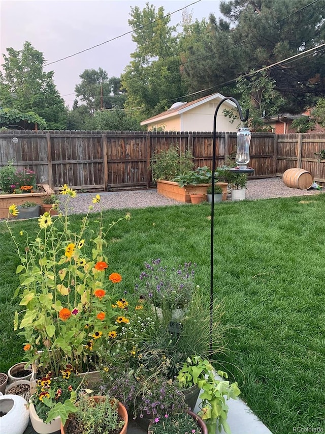 6614 Everett St, Arvada, CO 80004 - fenced backyard featuring a garden
