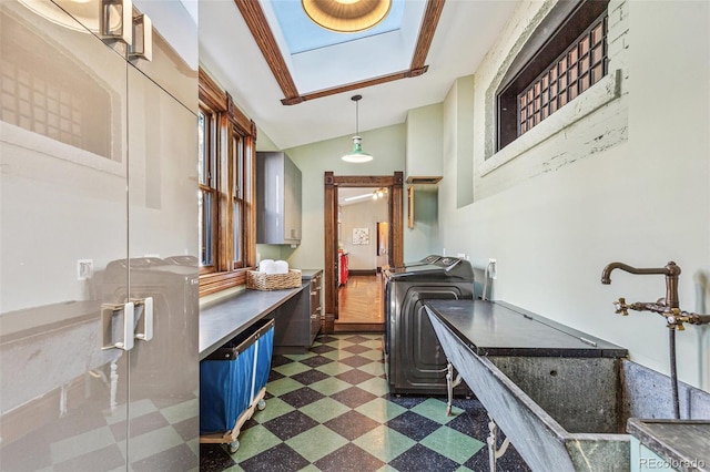 interior space featuring dark floors, washer / clothes dryer, and lofted ceiling