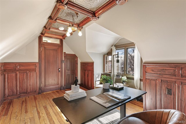 office area featuring vaulted ceiling, coffered ceiling, and light wood-style floors