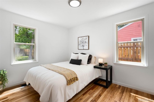 1180 Newark St, Aurora, CO 80010 - bedroom featuring wood finished floors and baseboards