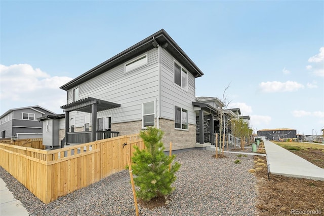 6225 N Nepal Ct, Aurora, CO 80019 - view of home's exterior with a pergola