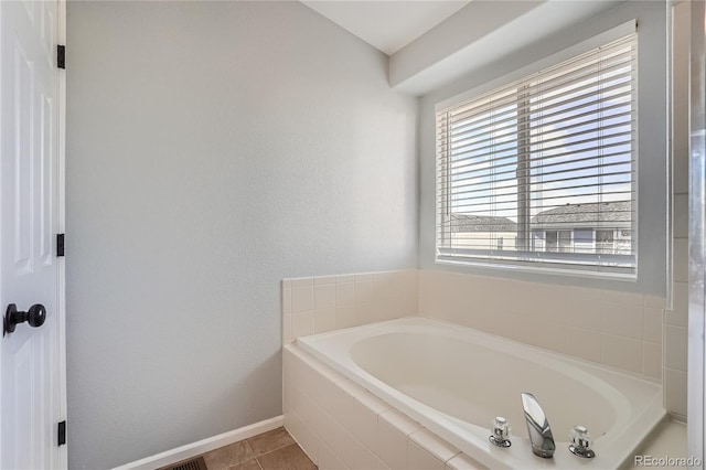 20521 E Bellewood Pl, Aurora, CO 80015 - bathroom with a garden tub, baseboards, and tile patterned flooring