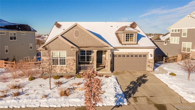 view of front of home featuring a garage and a porch