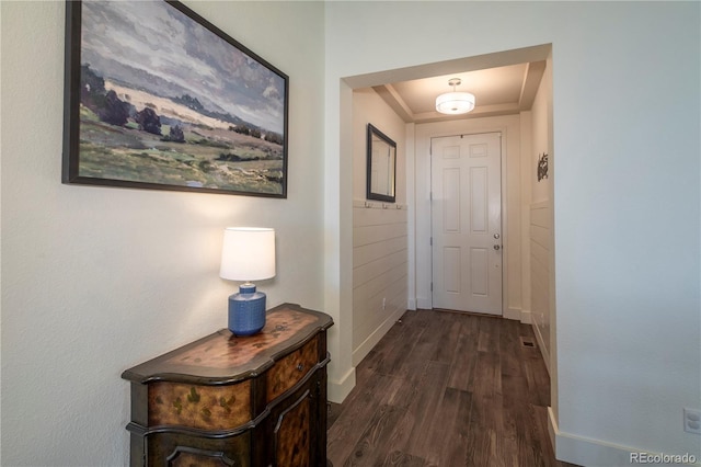 corridor featuring dark hardwood / wood-style flooring