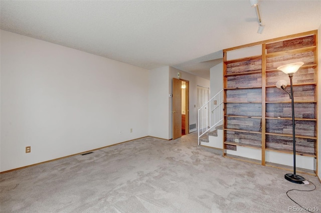 9188 W Ontario Dr, Littleton, CO 80128 - carpeted empty room featuring stairs and baseboards